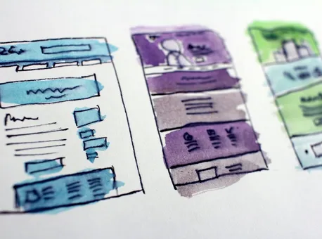 Watercolour wireframe sketches of website layouts
